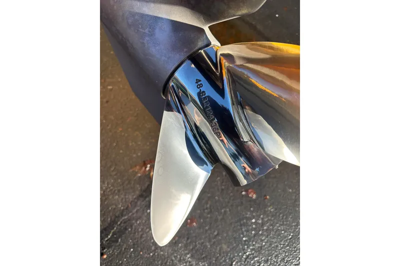 Slide: The Image of Close-up of a 2007 Eliminator Daytona 30 boat propeller on a wet surface. - 35