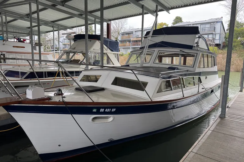 The Image of 1967 Pacemaker 37 boat docked in a covered marina. - 0