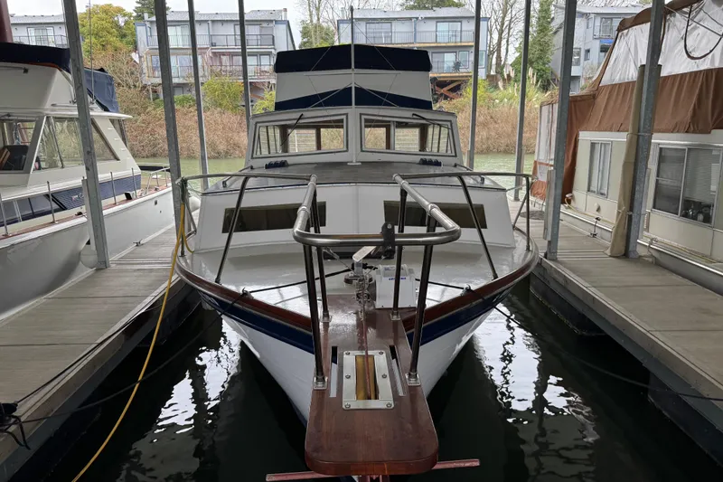 Slide: The Image of 1967 Pacemaker 37 boat docked in a marina, surrounded by other vessels. - 2