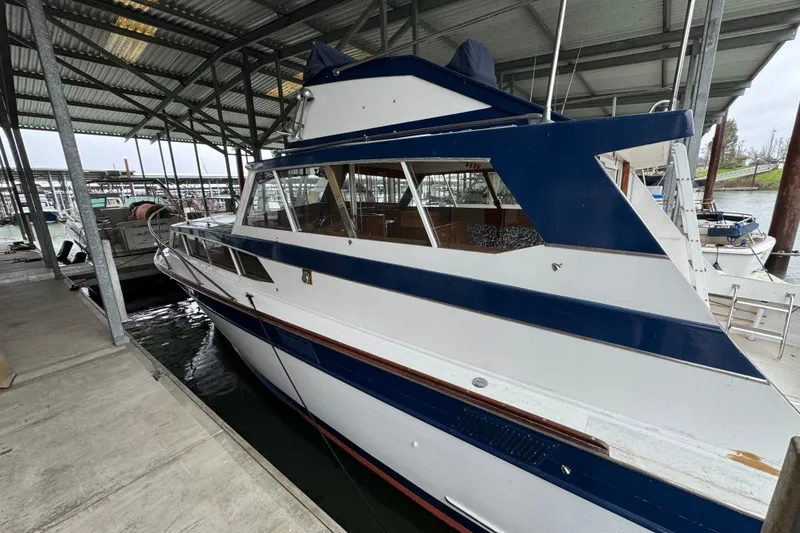 Slide: The Image of 1967 Pacemaker 37 boat docked in a covered marina. - 3