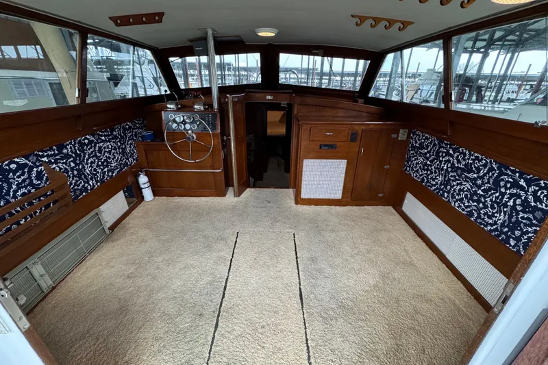 Slide: The Image of Interior of a 1967 Pacemaker 37 boat with wood paneling and nautical decor. - 7