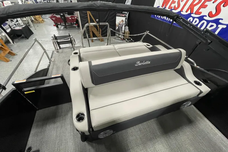 Slide: The Image of 2026 Barletta Cabrio 22UC pontoon boat interior with plush seating and cup holders. - 11