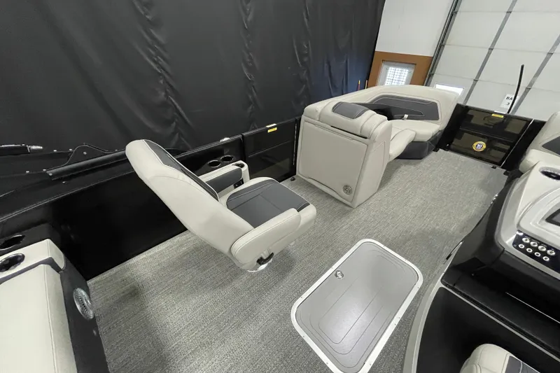 Slide: The Image of 2026 Barletta Cabrio 22UC interior with gray seating and carpeted flooring. - 12