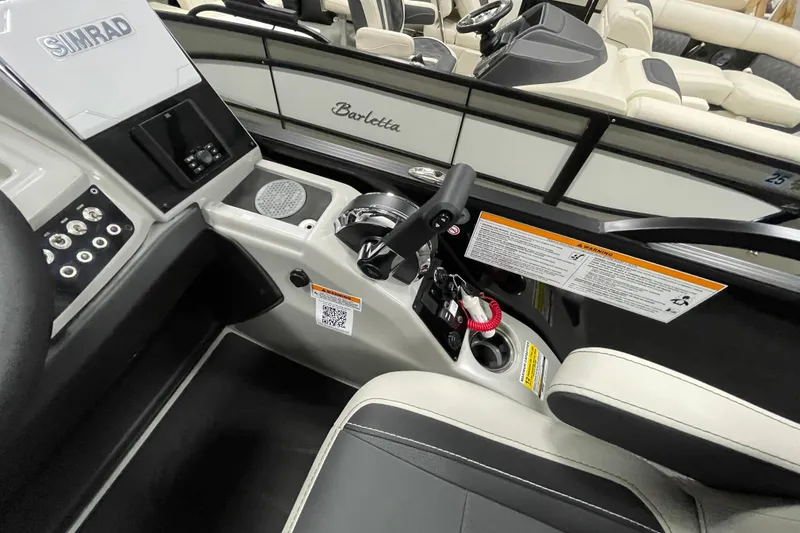 Slide: The Image of 2026 Barletta Cabrio 22UC boat interior with control panel and seating. - 13