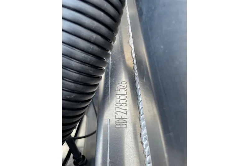 Slide: The Image of Close-up of Barletta Cabrio 22UC 2026 serial number on metal surface. - 14