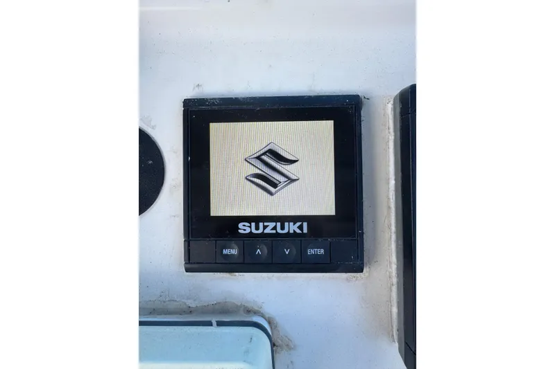 Slide: The Image of Suzuki display screen on 2001 Parker 2110 Walkaround boat dashboard. - 11