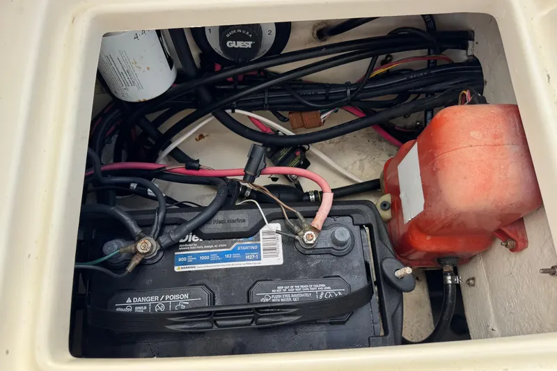 Slide: The Image of Battery compartment of a 2001 Parker 2110 Walkaround boat with wiring and components. - 23