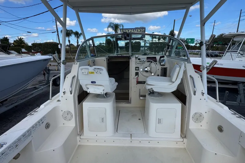 Slide: The Image of 2001 Parker 2110 Walkaround boat interior with dual seats and steering wheel. - 4