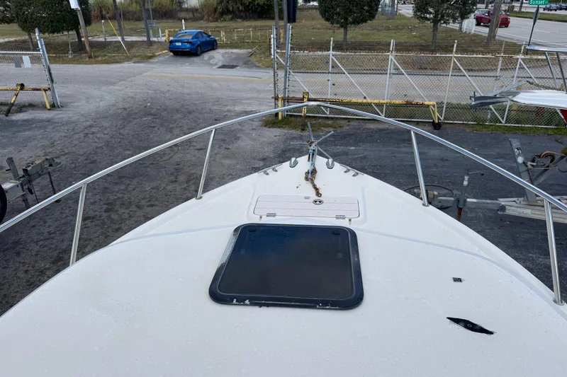 Slide: The Image of 2001 Parker 2110 Walkaround boat bow view at a marina. - 5