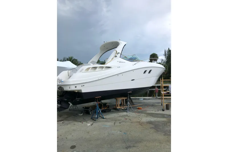 Slide: The Image of 2008 Sea Ray 310 Sundancer yacht on dry dock, ready for maintenance. - 33