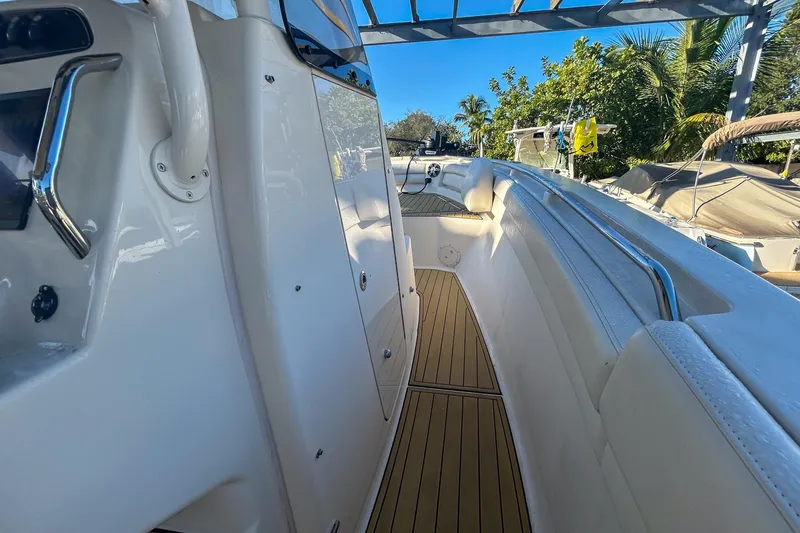Slide: The Image of 2021 Grady-White Freedom 325 boat interior with sleek design and wooden flooring. - 10