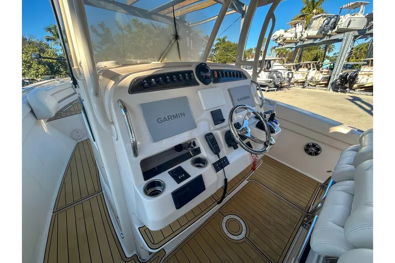 Slide: The Image of 2021 Grady-White Freedom 325 boat dashboard with Garmin navigation system. - 16