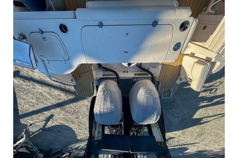 Slide: The Image of 2021 Grady-White Freedom 325 boat interior with covered seats and storage compartments. - 17