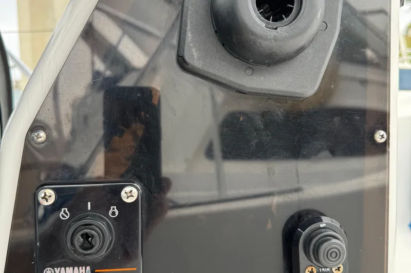 Slide: The Image of Control panel of a 2005 MacGregor 26M Powersailer with Yamaha ignition switch. - 12