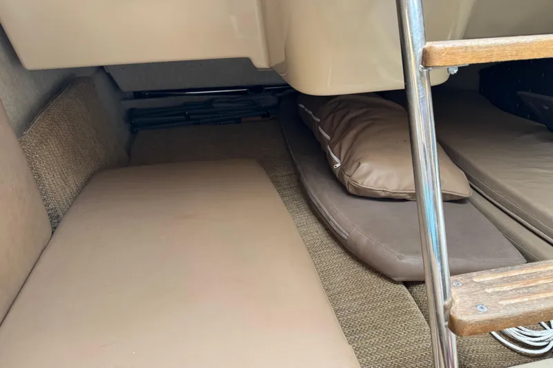 Slide: The Image of Interior cabin of 2005 MacGregor 26M Powersailer with cushions and ladder. - 20