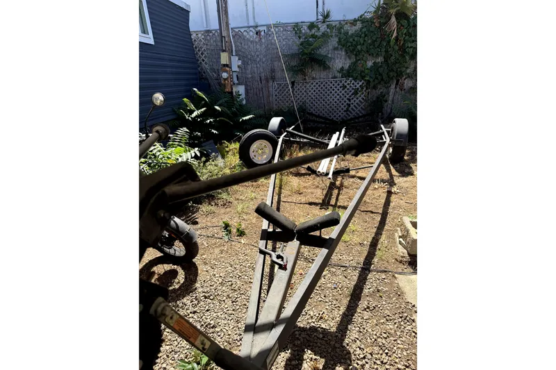 Slide: The Image of Trailer for 2005 MacGregor 26M Powersailer in a garden setting. - 34