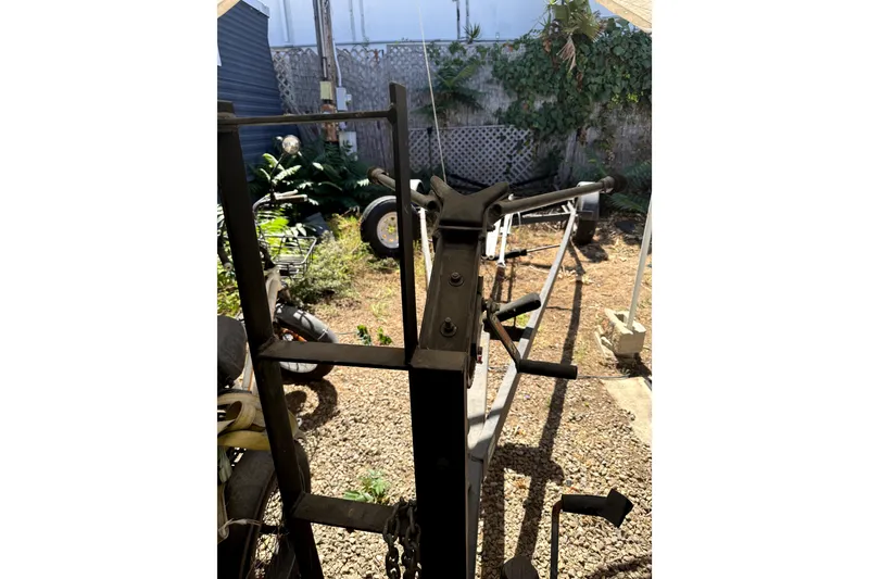 Slide: The Image of Trailer hitch for 2005 MacGregor 26M Powersailer in a garden setting. - 35