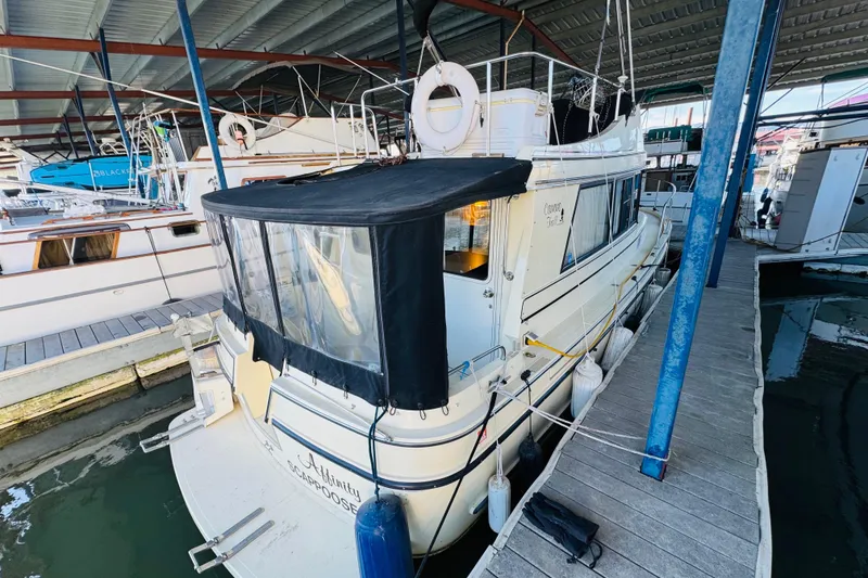 Slide: The Image of 2004 Camano 31 Troll boat docked in a covered marina. - 21