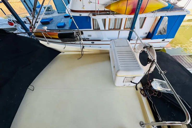 Slide: The Image of 2004 Camano 31 Troll boat deck with cooler and safety equipment. - 30