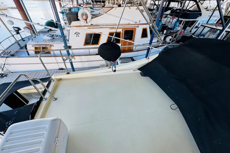 Slide: The Image of 2004 Camano 31 Troll boat docked at marina, view of deck and surrounding vessels. - 31