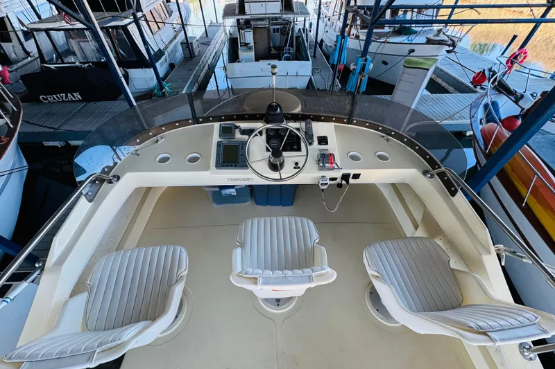 Slide: The Image of 2004 Camano 31 Troll boat helm with three seats and navigation equipment. - 33