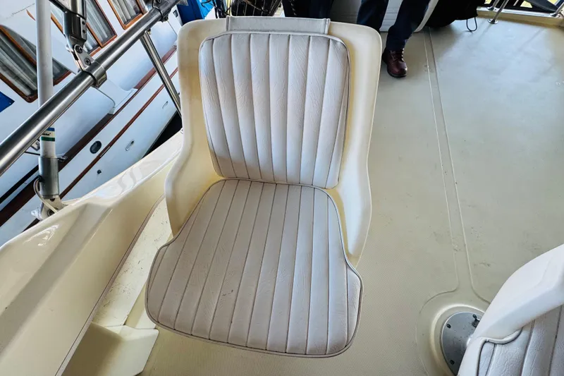 Slide: The Image of White captain's chair on 2004 Camano 31 Troll boat deck. - 35