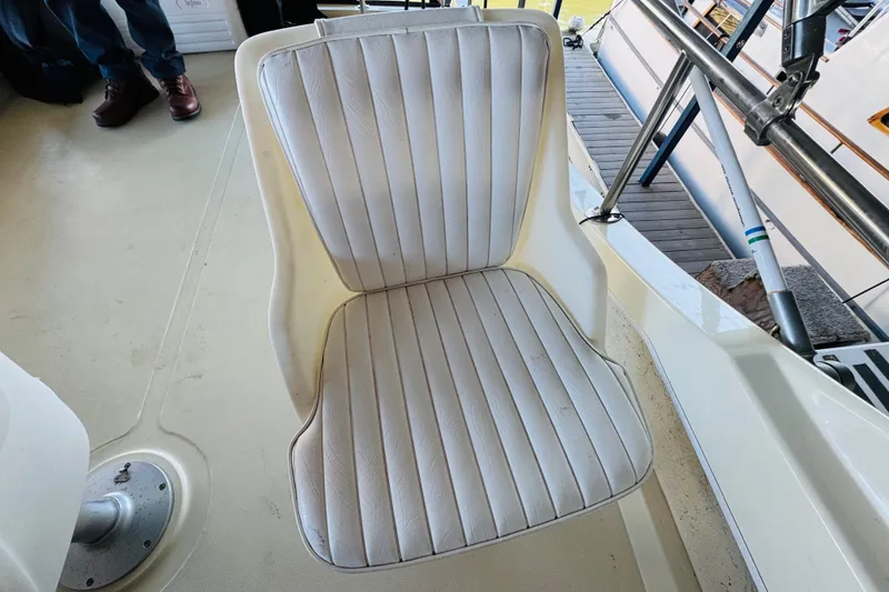 Slide: The Image of White cushioned seat on 2004 Camano 31 Troll boat deck. - 37