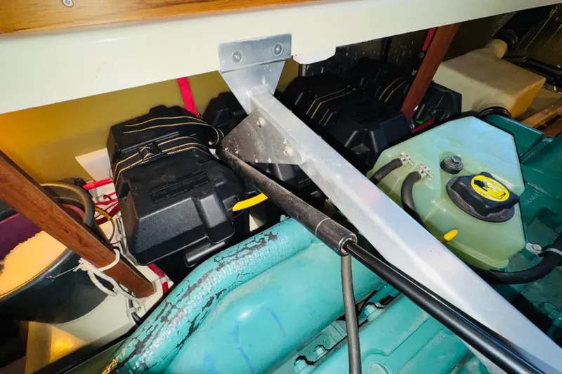 Slide: The Image of Engine compartment of a 2004 Camano 31 Troll boat, showing battery and fuel system components. - 41