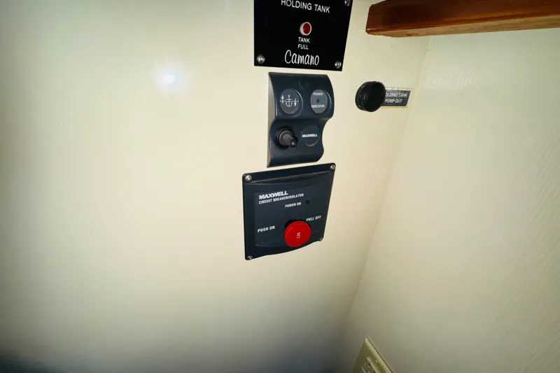 Slide: The Image of Control panel of a 2004 Camano 31 Troll boat, featuring Maxwell circuit breaker. - 52