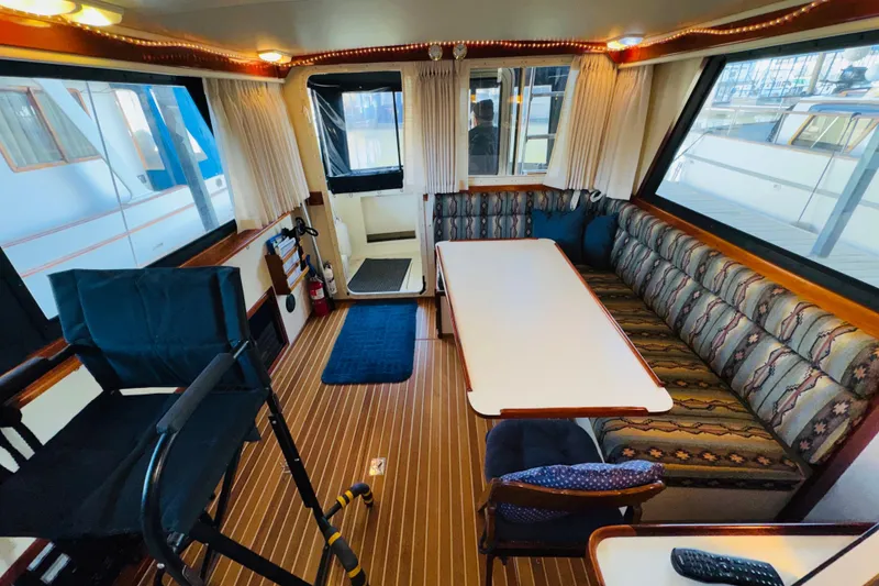 Slide: The Image of Interior of 2004 Camano 31 Troll boat with seating and table. - 7