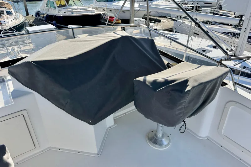 Slide: The Image of 2001 Sabre Sedan Bridge boat with covered controls and seating on deck. - 16