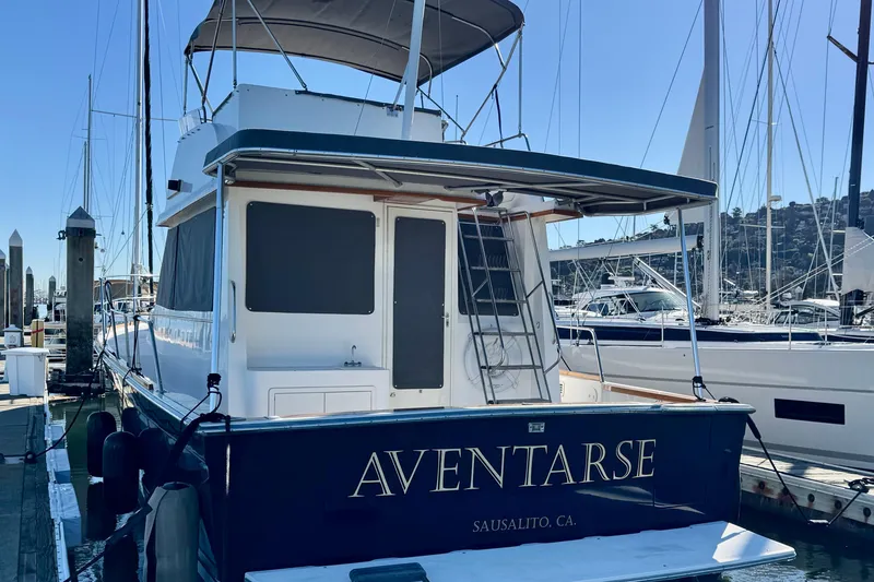 Slide: The Image of 2001 Sabre Sedan Bridge yacht docked in Sausalito marina, rear view. - 2