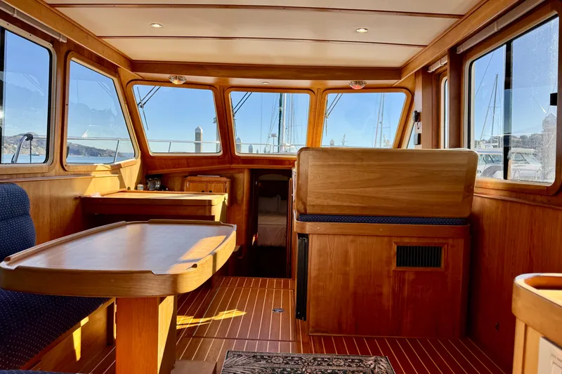 Slide: The Image of Interior of 2001 Sabre Sedan Bridge yacht with wooden furnishings and large windows. - 28