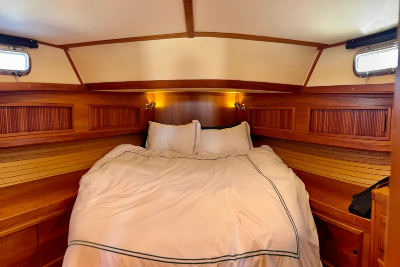 Slide: The Image of Luxurious 2001 Sabre Sedan Bridge cabin with cozy bed and elegant wood paneling. - 37