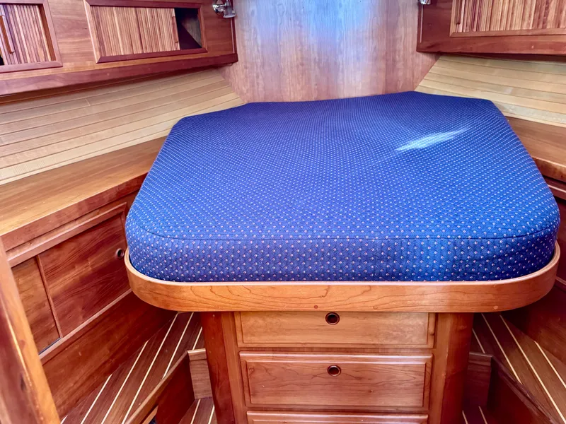 Slide: The Image of Interior of a 2001 Sabre Sedan Bridge with wooden furniture and blue mattress. - 38