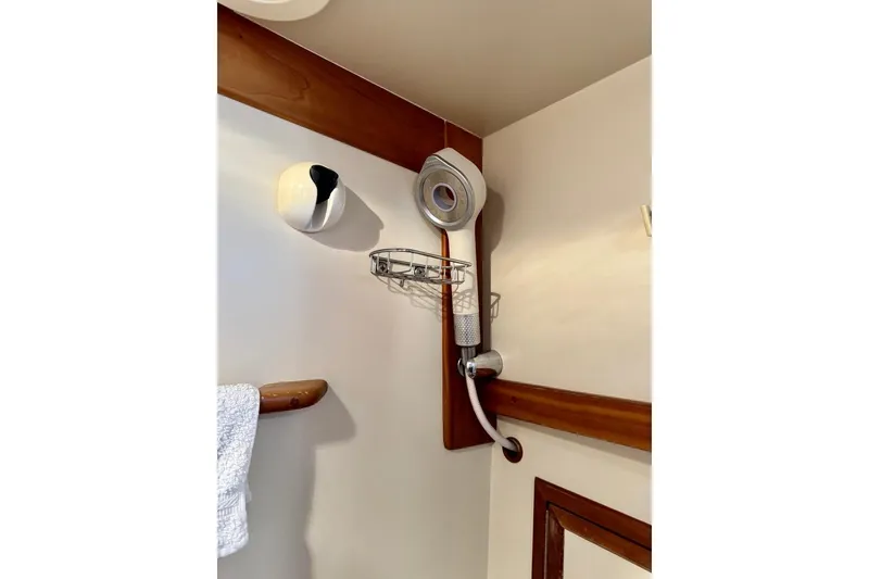 Slide: The Image of Shower area in 2001 Sabre Sedan Bridge boat with wooden accents. - 40