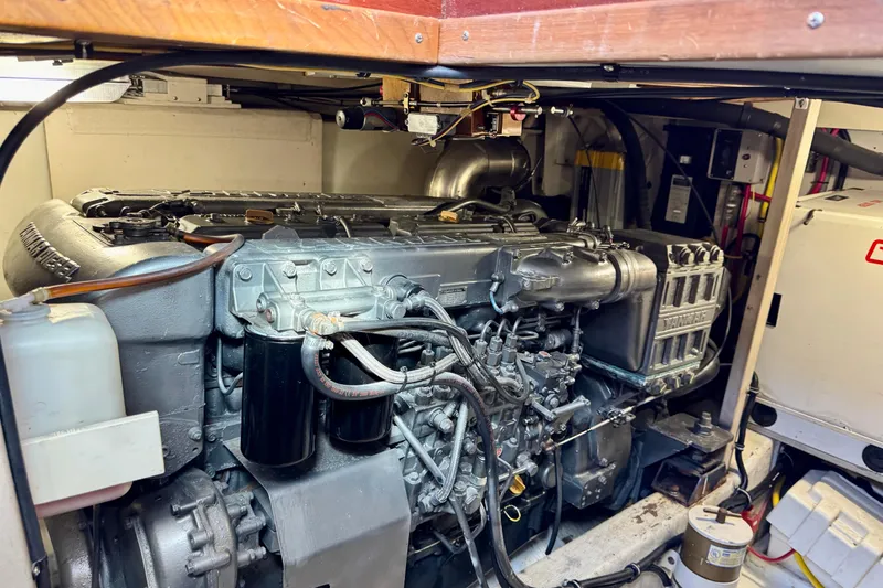 Slide: The Image of Engine room of a 2001 Sabre Sedan Bridge, showcasing detailed mechanical components. - 48