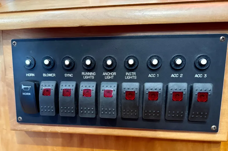 Slide: The Image of Control panel of a 2001 Sabre Sedan Bridge with labeled switches and buttons. - 59