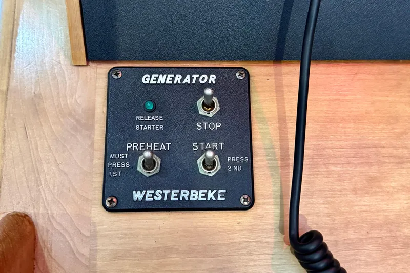 Slide: The Image of Westerbeke generator control panel on 2001 Sabre Sedan Bridge boat. - 68