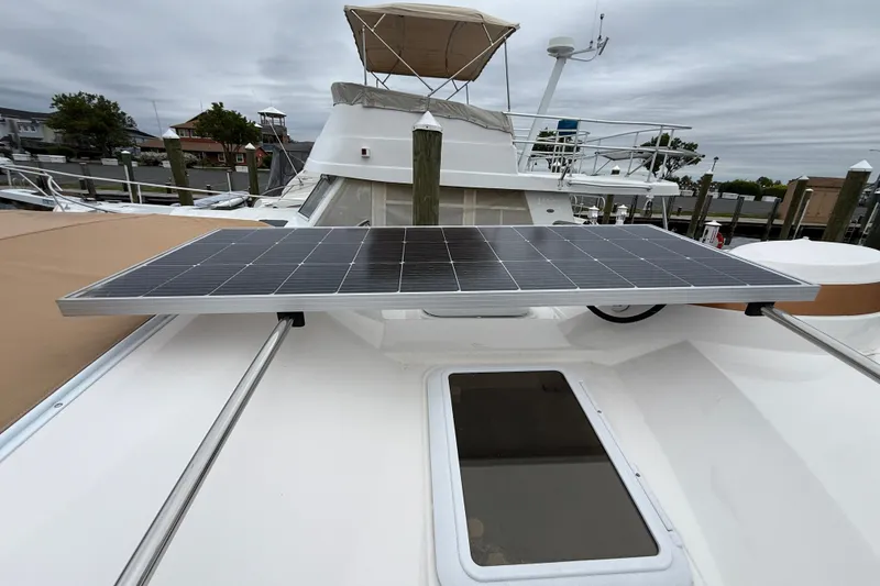 Slide: The Image of 2024 Ranger Tugs R-27 storage compartment with ropes and electrical components. - 31