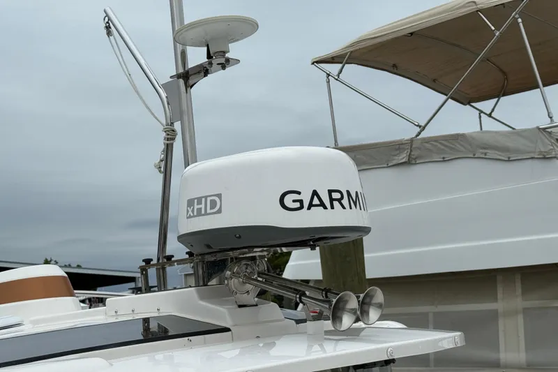 Slide: The Image of 2024 Ranger Tugs R-27 with solar panel on deck, docked at marina. - 32