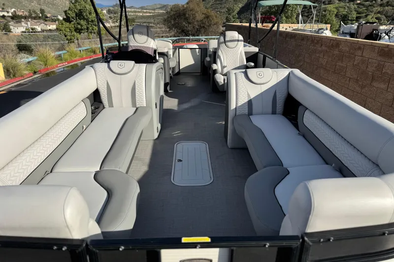 Slide: The Image of Interior of a 2020 Godfrey Monacco 255 SD pontoon boat with luxurious seating. - 10