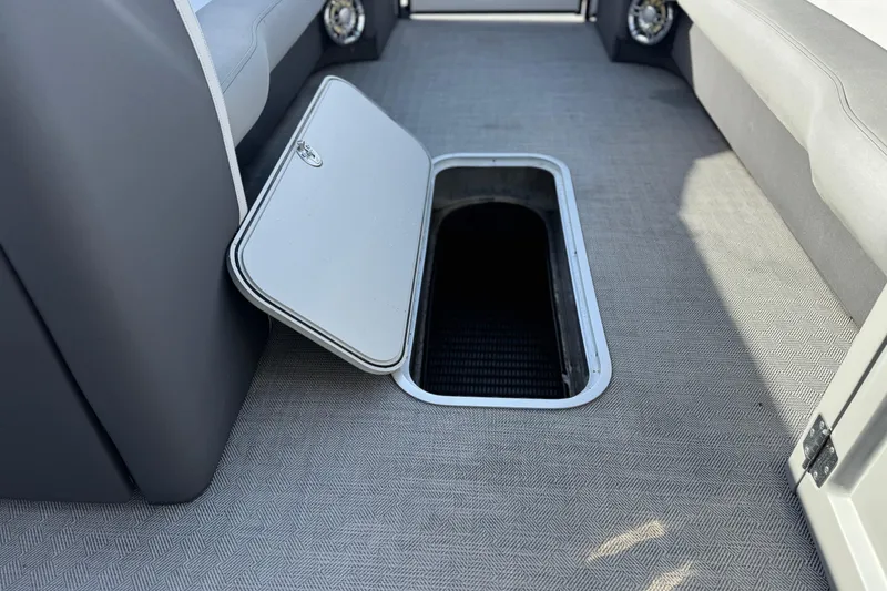 Slide: The Image of Open storage compartment on 2020 Godfrey Monacco 255 SD boat interior. - 15