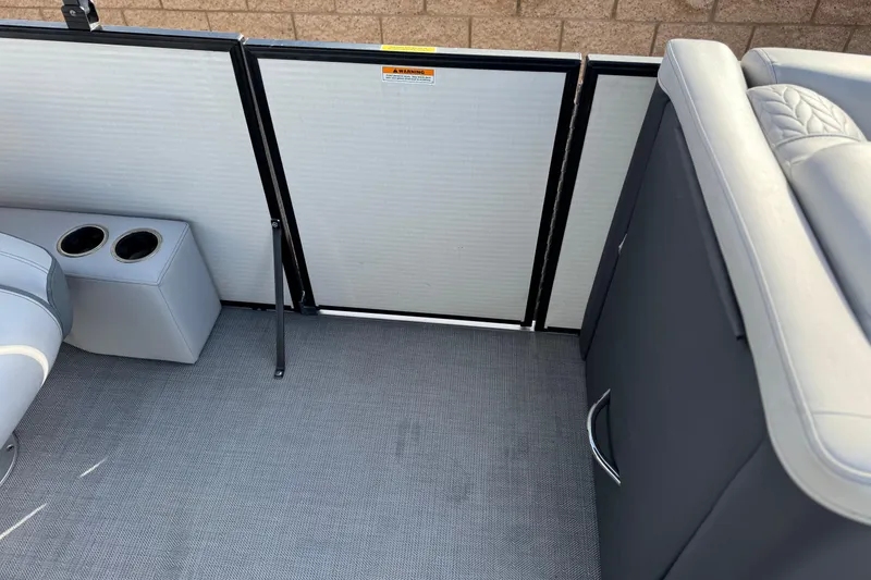 Slide: The Image of Interior of 2020 Godfrey Monacco 255 SD boat with seating and storage. - 16