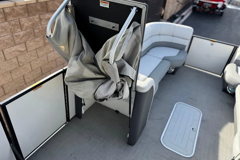 Slide: The Image of 2020 Godfrey Monacco 255 SD boat interior with seating and storage compartments. - 17