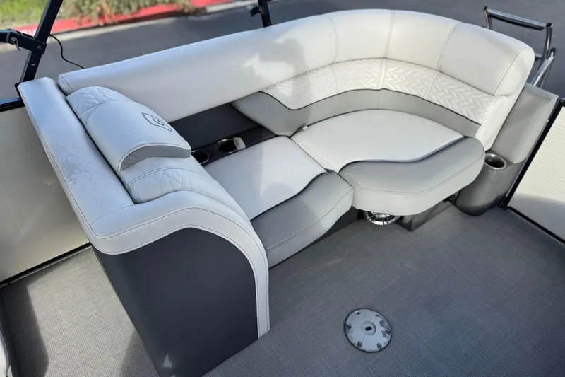 Slide: The Image of Luxurious seating on 2020 Godfrey Monacco 255 SD boat, featuring elegant gray upholstery. - 21