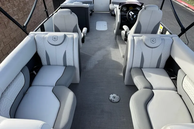 Slide: The Image of Interior of a 2020 Godfrey Monacco 255 SD boat with luxurious seating. - 24