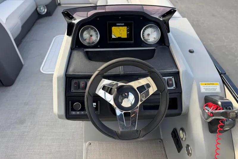 Slide: The Image of Steering console of 2020 Godfrey Monacco 255 SD boat with navigation display. - 27