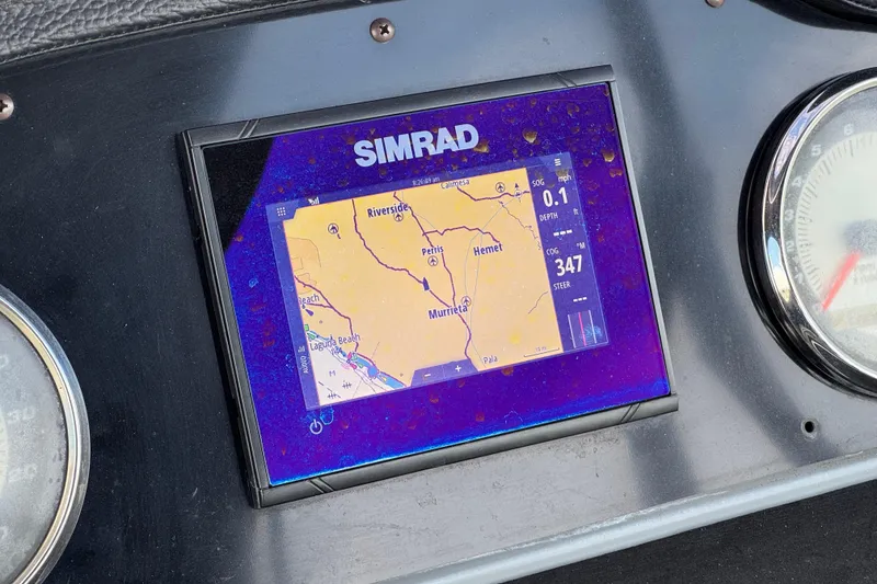 Slide: The Image of Simrad navigation display on 2020 Godfrey Monacco 255 SD boat dashboard. - 28