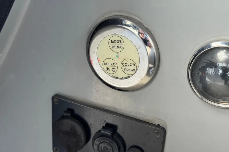 Slide: The Image of Control panel on 2020 Godfrey Monacco 255 SD boat, featuring mode and color settings. - 32